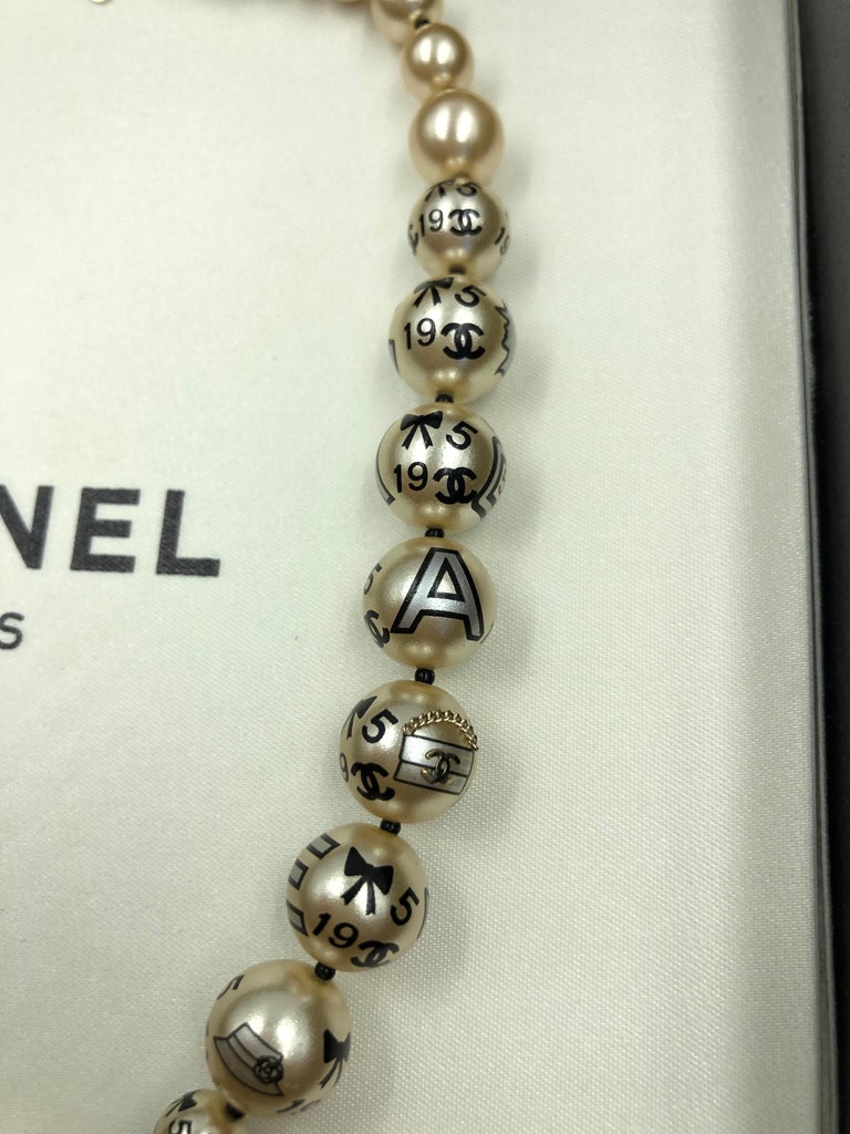 Chanel 1990's Faux Pearls with Coco Chanel Print on Strand