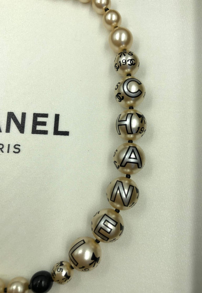 Chanel 1990's Faux Pearls with Coco Chanel Print on Strand