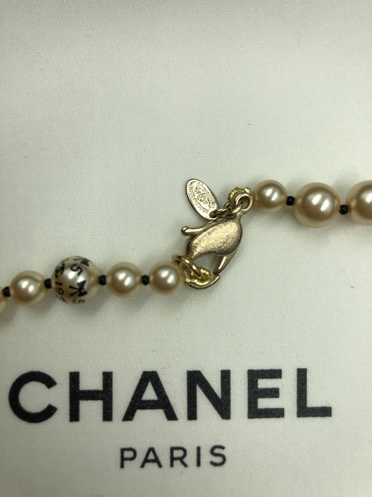 Chanel 1990's Faux Pearls with Coco Chanel Print on Strand