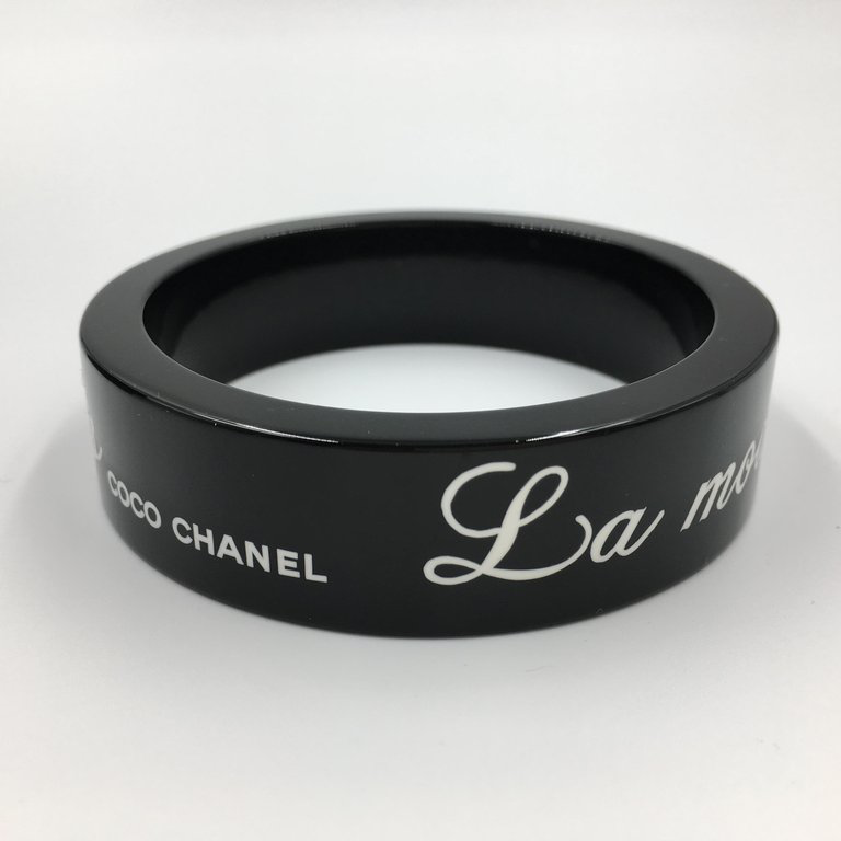 Chanel Black Logo Bangle - La Mode se Demode. Le Style Jamais Coco Chanel