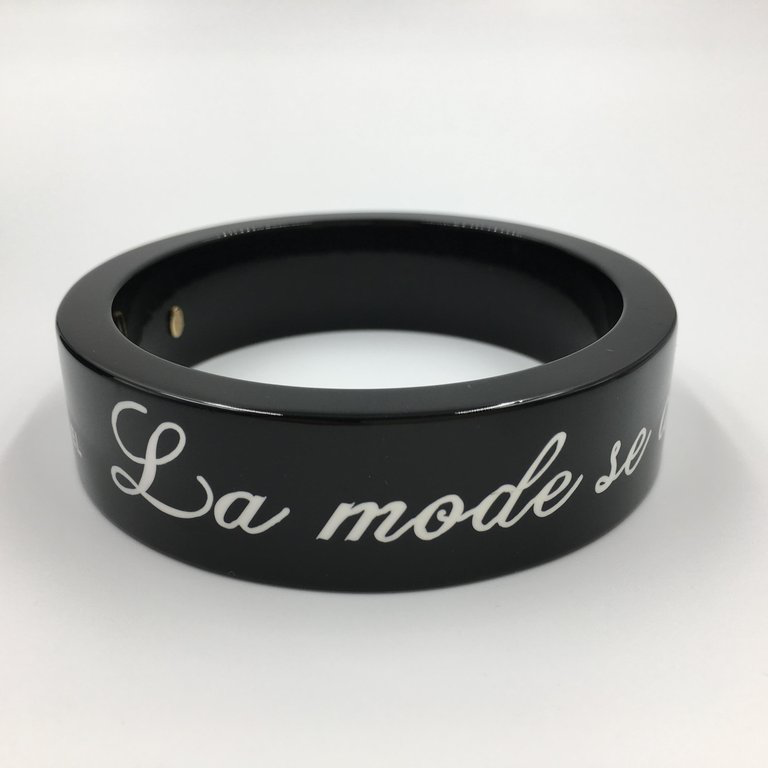 Chanel Black Logo Bangle - La Mode se Demode. Le Style Jamais Coco Chanel