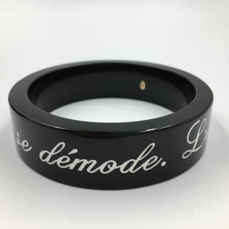Chanel Black Logo Bangle - La Mode se Demode. Le Style Jamais Coco Chanel