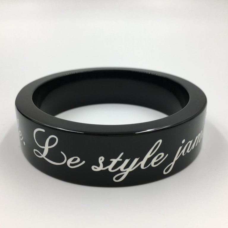 Chanel Black Logo Bangle - La Mode se Demode. Le Style Jamais Coco Chanel