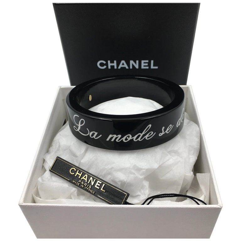 Chanel Black Logo Bangle - La Mode se Demode. Le Style