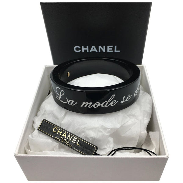 Chanel Black Logo Bangle - La Mode se Demode. Le Style Jamais Coco Cha –  catwalk