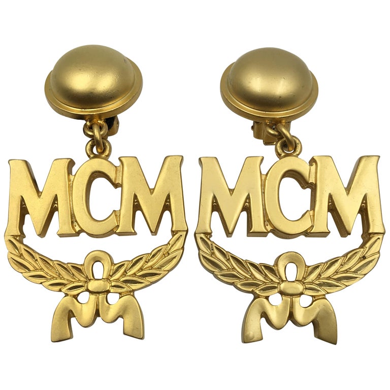 MCM Wreath Logo Matte Gold Tone Clip On Earrings