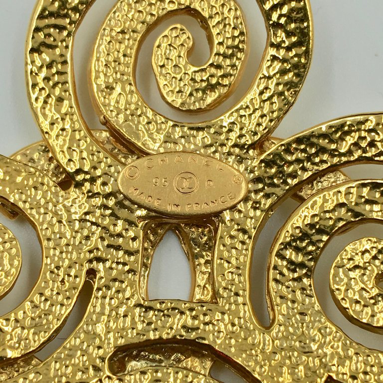 Chanel Gold Tone CC Logo Swirl Cross Necklace